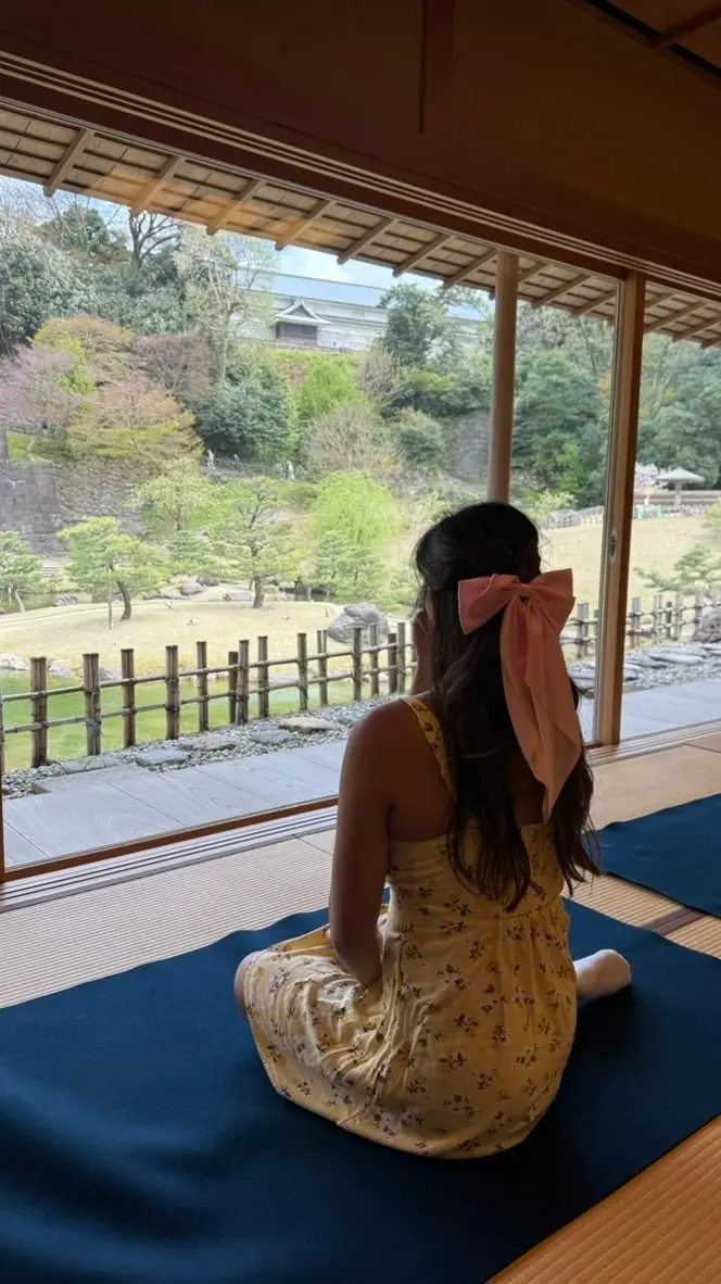 Vania in a tatami tea house overlooking a Japanese garden