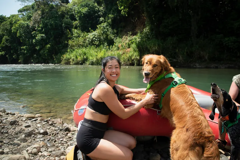 Vania river rafting in Costa Rica with a golden retriever on board